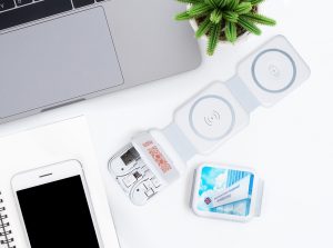 Creative flat lay photo of workspace desk. Top view office desk Creative flat lay photo of workspace desk. Top view office desk with laptop, phone, pencil, notebook and plant on white color background. Top view with copy space, flat lay photography.