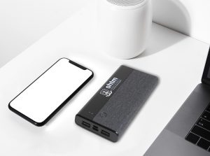 Smartphone on white wireless charger pad Smartphone on white wireless charger pad